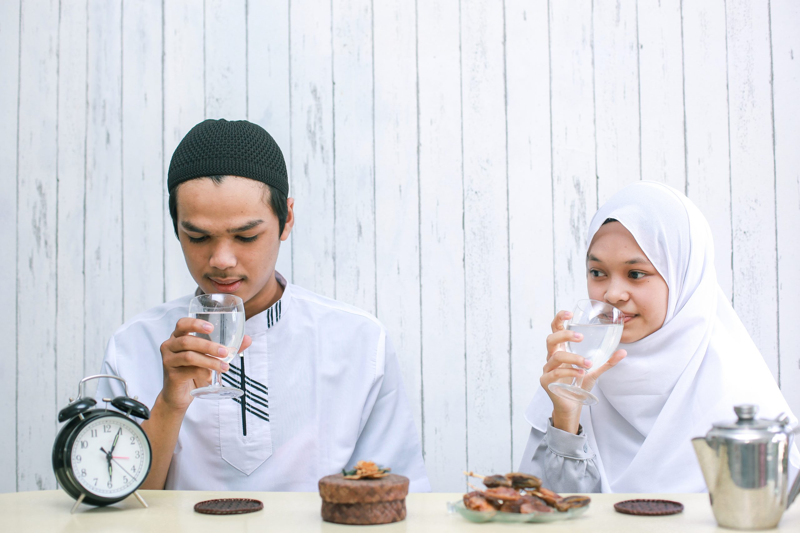 muslim-couple-drinking-together-at-iftar-time-2021-09-01-00-34-42-utc-scaled